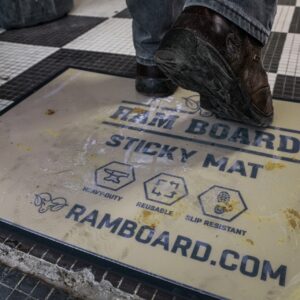 boots walking over dirty sticky mat